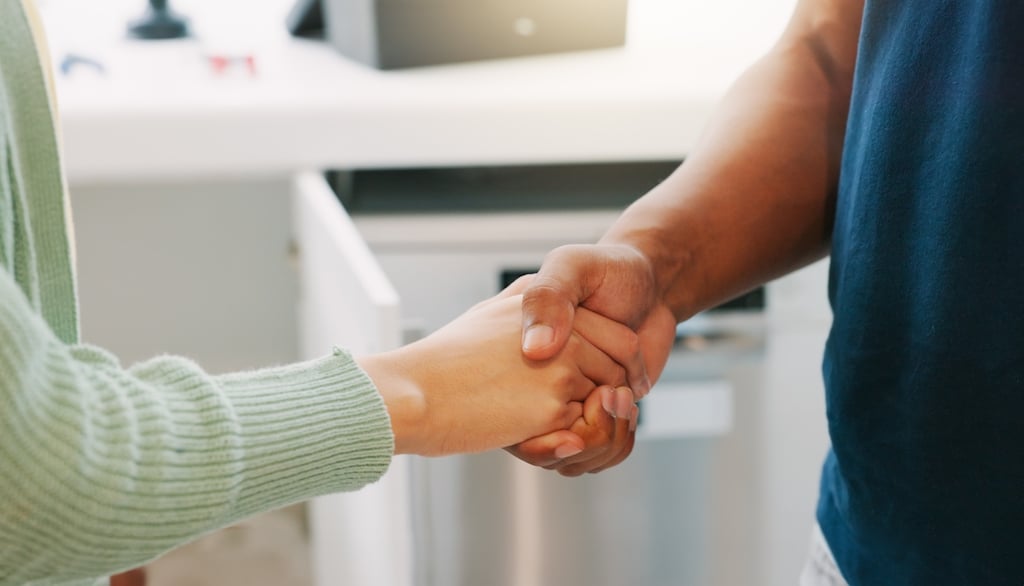 Woman and professional shaking hands in kitchen. | Expansion Tank