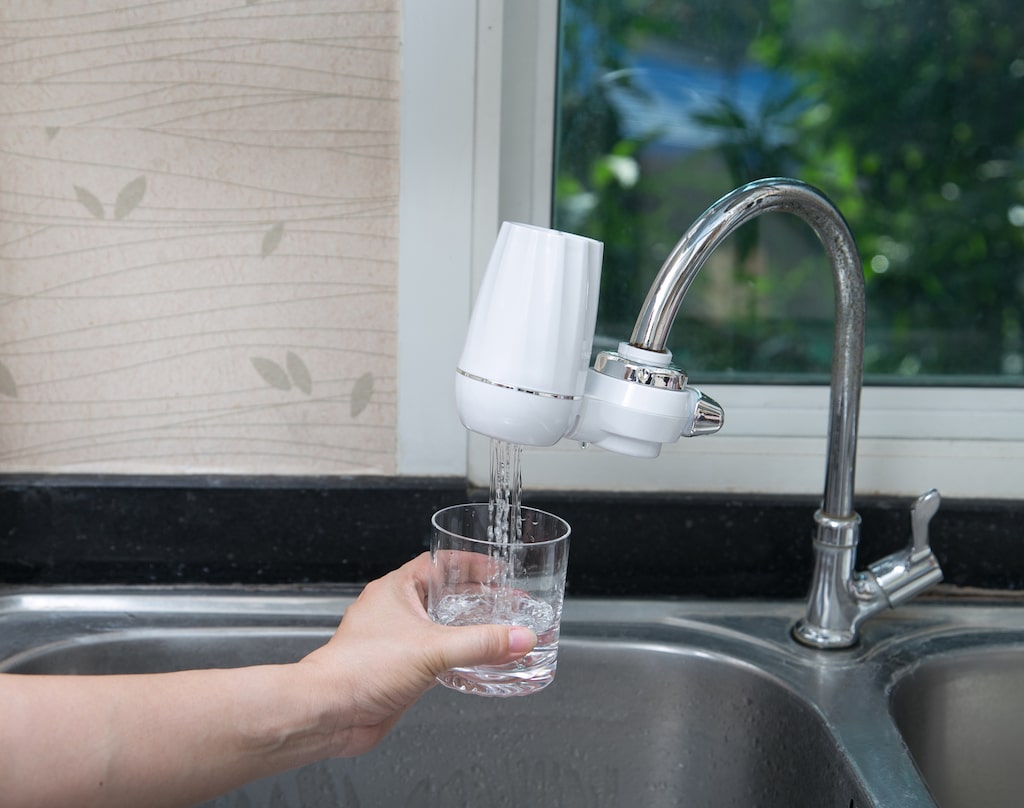 Water filtration system directly on faucet.