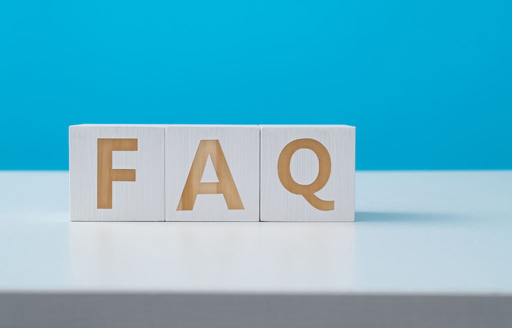 Wooden blocks with the word FAQ blue background. Bathroom sink replacement