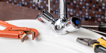 Bathroom plumbing faucet with tools from bathroom plumber.