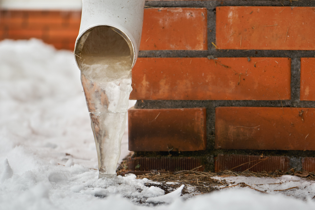 A frozen pipe on a brick house. Winter plumbing tips.