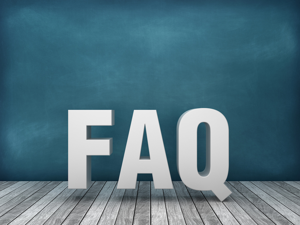 Large letters reading FAQ with blue background and wood flooring.