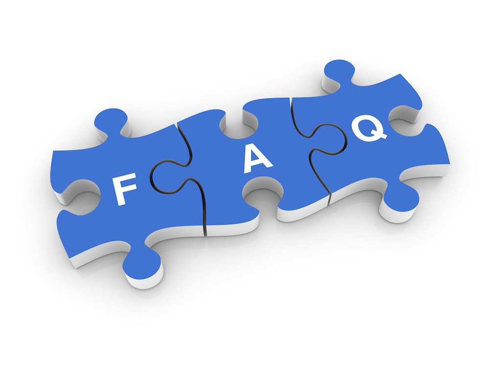 Blue puzzle pieces with white letters spelling FAQ. Representing questions about drain cleaning service.