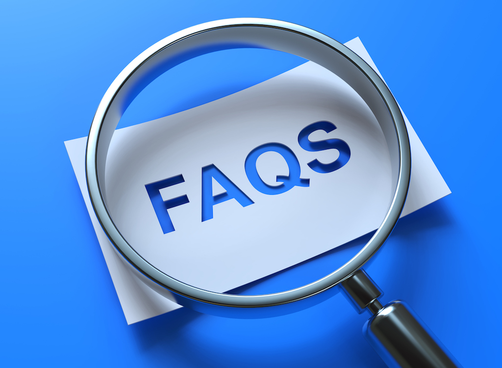 FAQs in magnifying glass. on blue background. | Plumbing Service