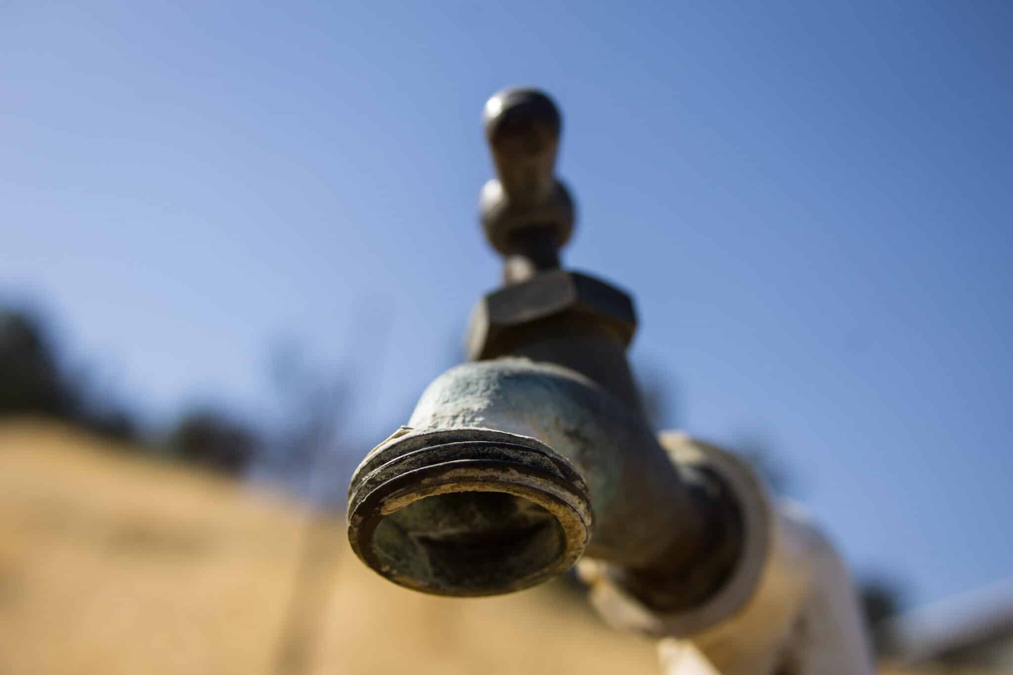 Brass spigot with oxidation and scale buildup, Outdoor Water Fixtures.