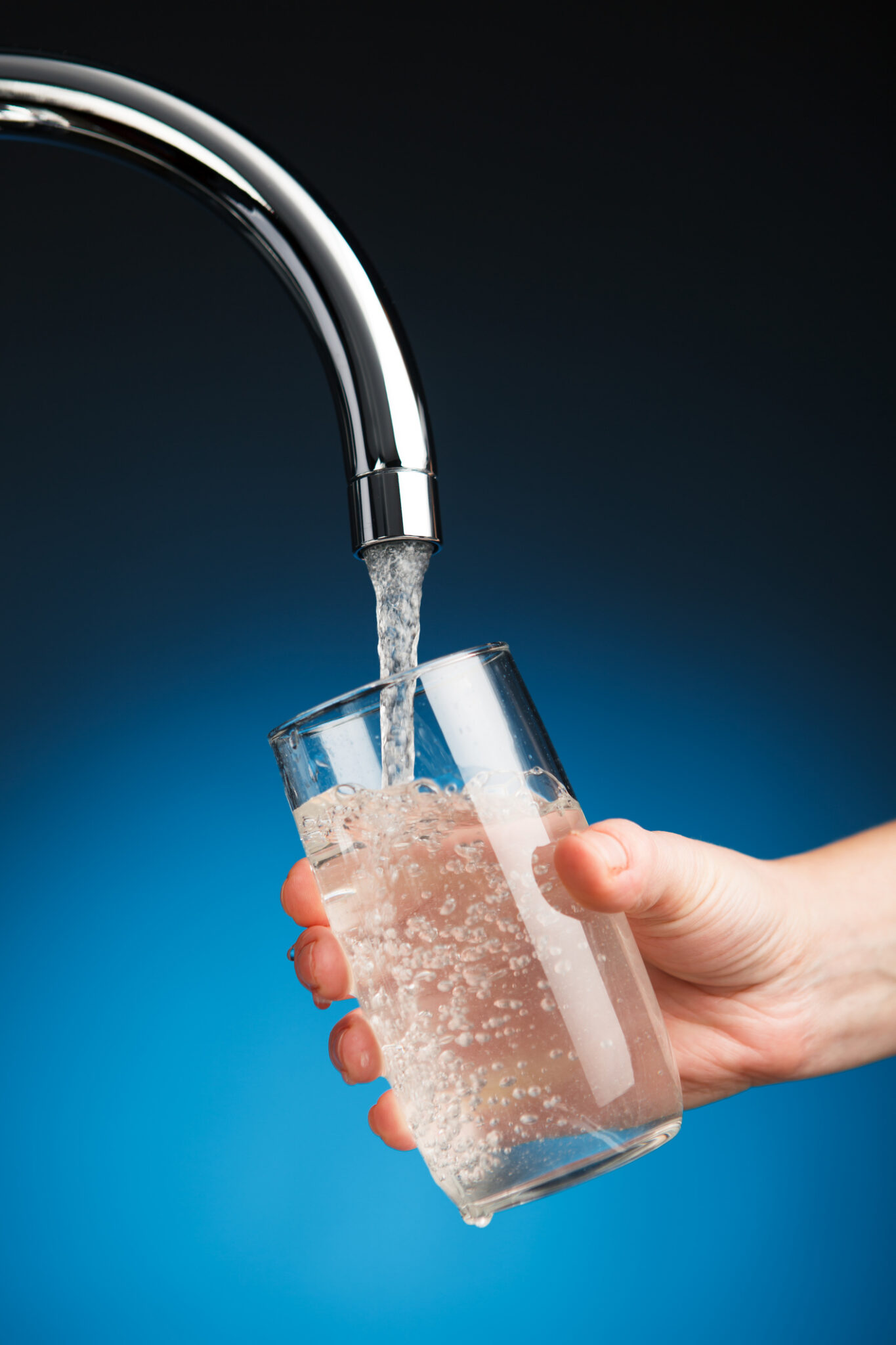 Backflow testing for safer drinking tap water on a blue background.