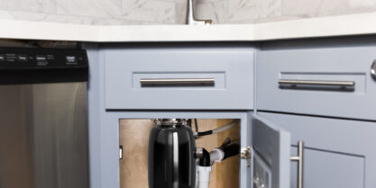 Garbage disposal installation under the sink.