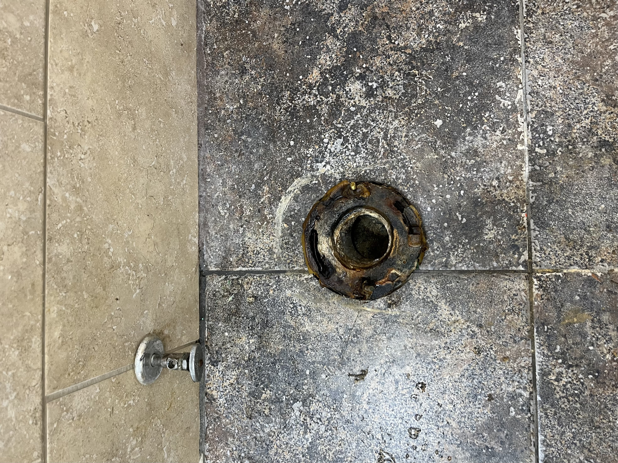 Toilet flange repair or replacement is required due to corroded metal flange problems.