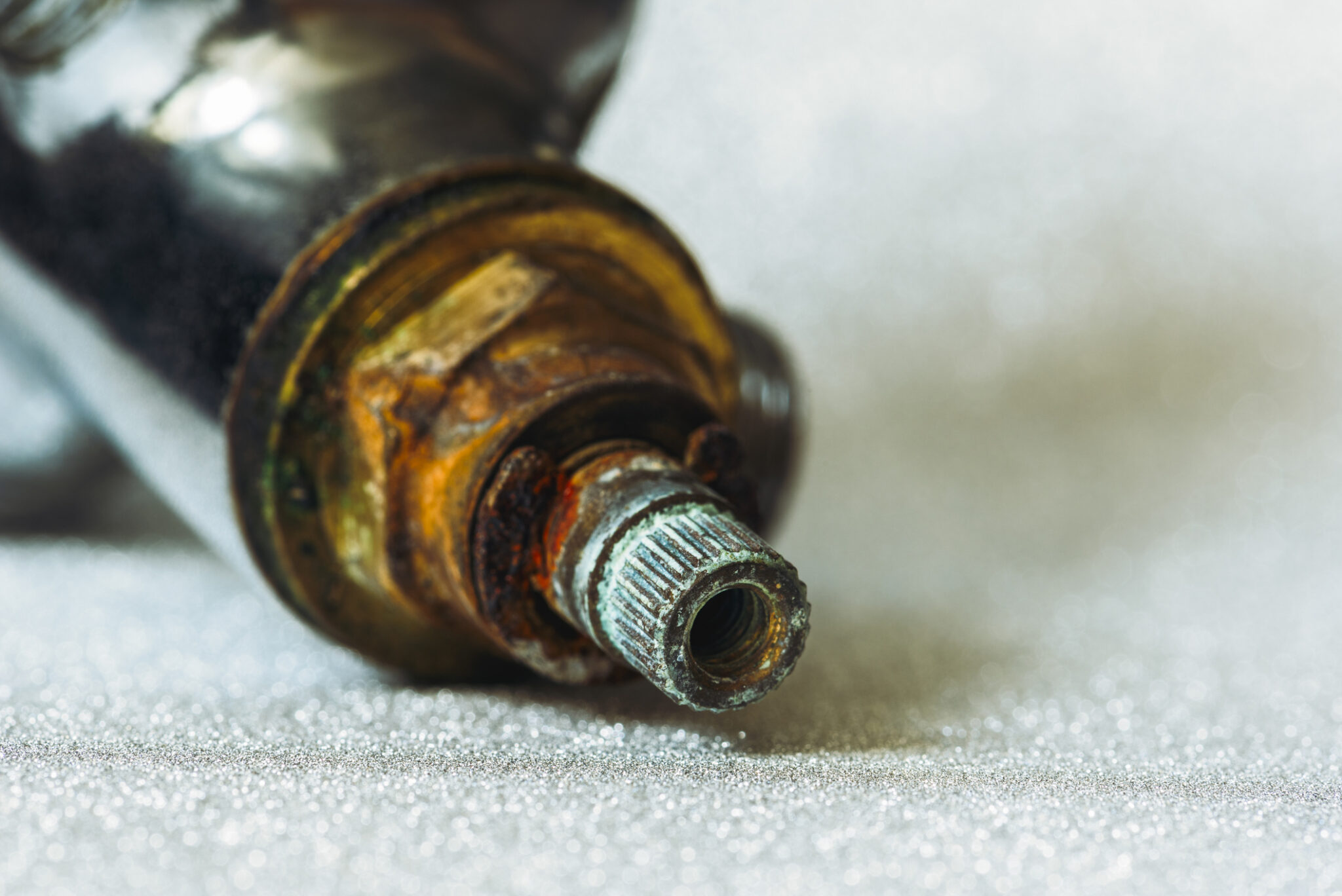 Professional faucet cartridge replacement for an old bathroom faucet to fix leaks and improve performance.