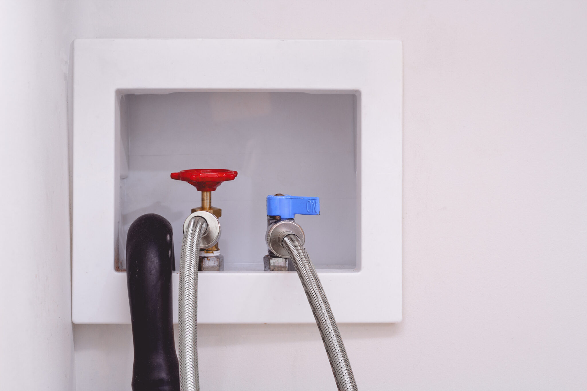 Washing machine supply lines.