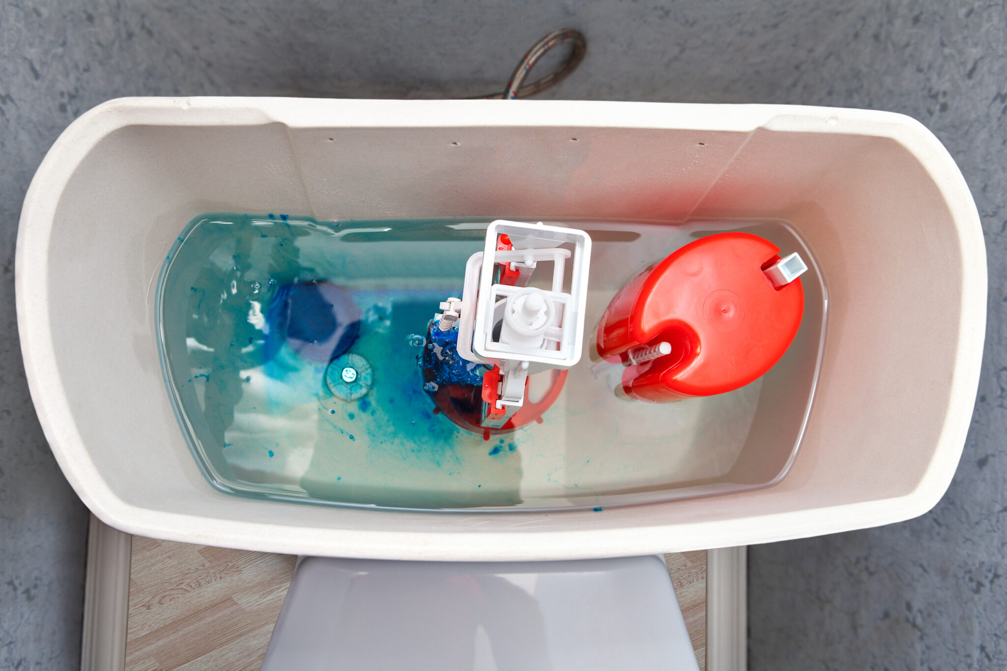Leak detection dye tablets placed in a toilet tank.